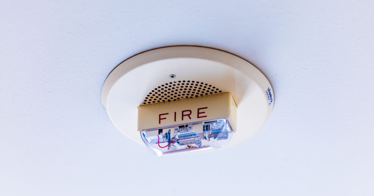 Close-up view of a ceiling-mounted fire alarm system ensuring safety in a building.